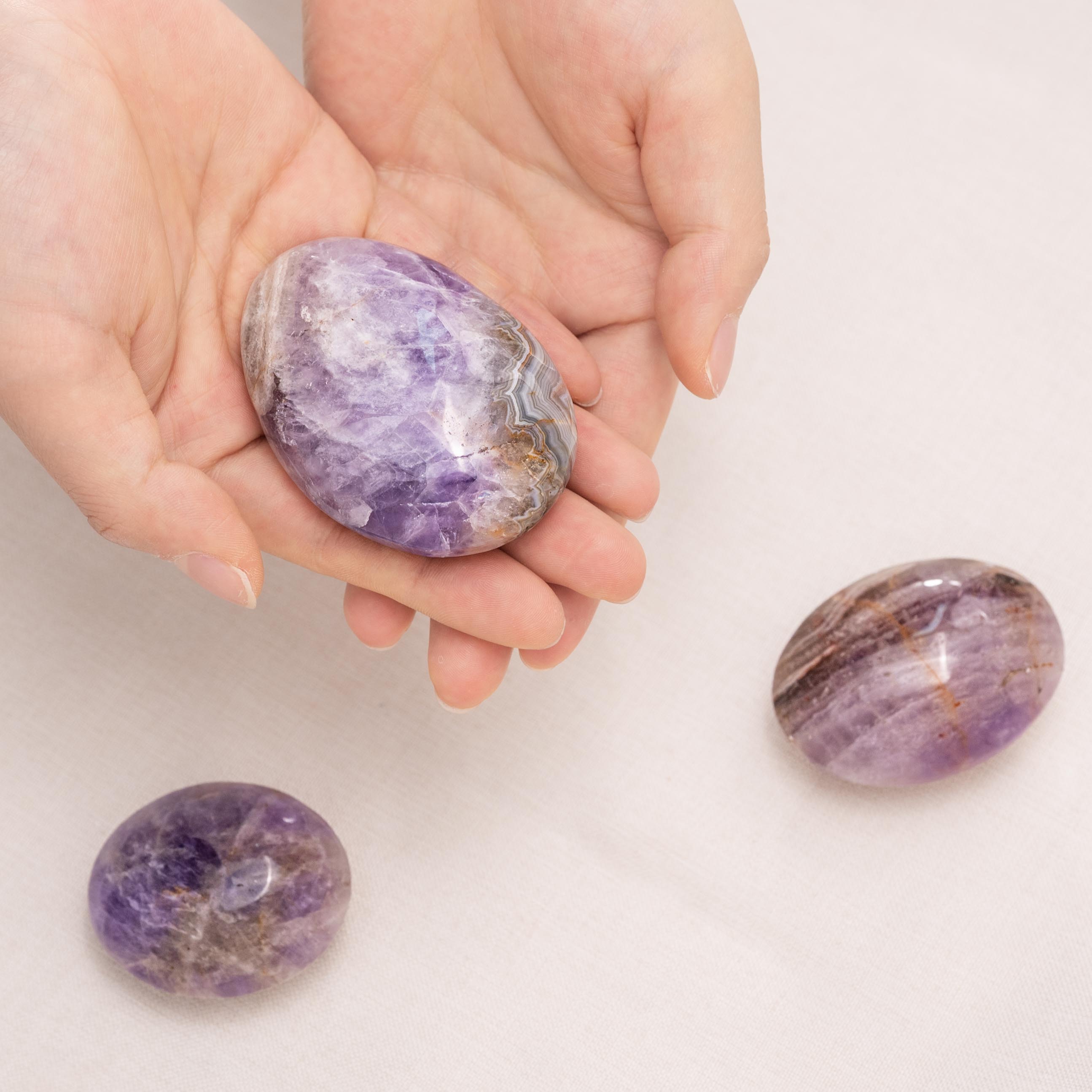Hand-polished Amethyst Agate Palm Stone, perfect for enhancing tranquility