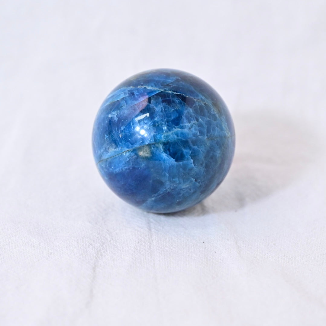 The Blue Apatite sphere can help balance and align these key energy centers, supporting enhanced self-expression, intuition