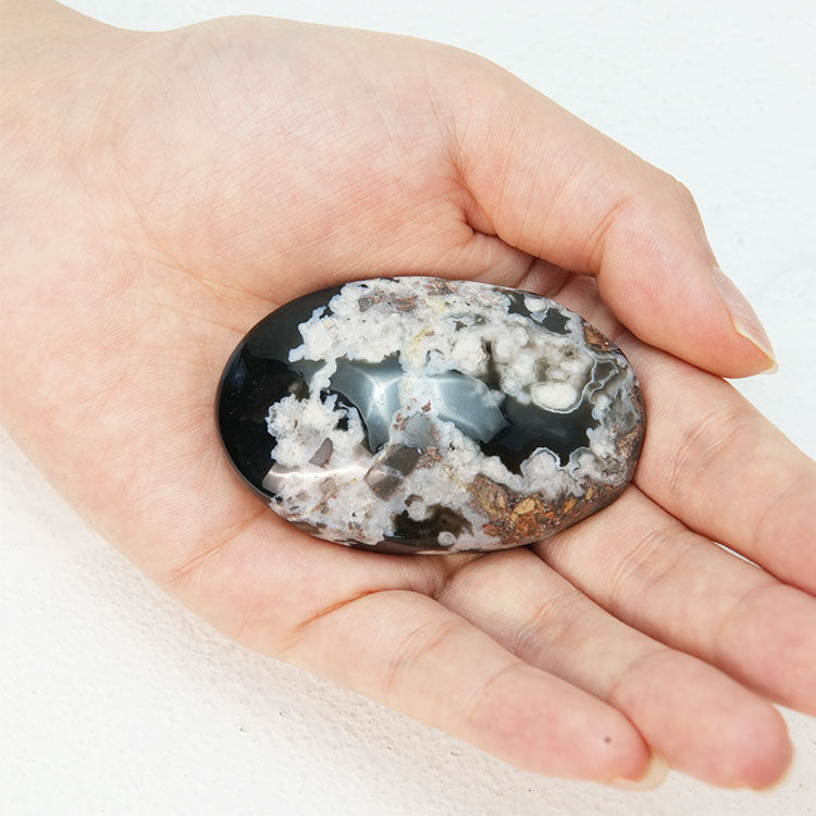 Black Flower Agate Palmstone showcasing its natural beauty