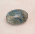 Blue Onyx Palm Stone with deep blue hues and natural patterns