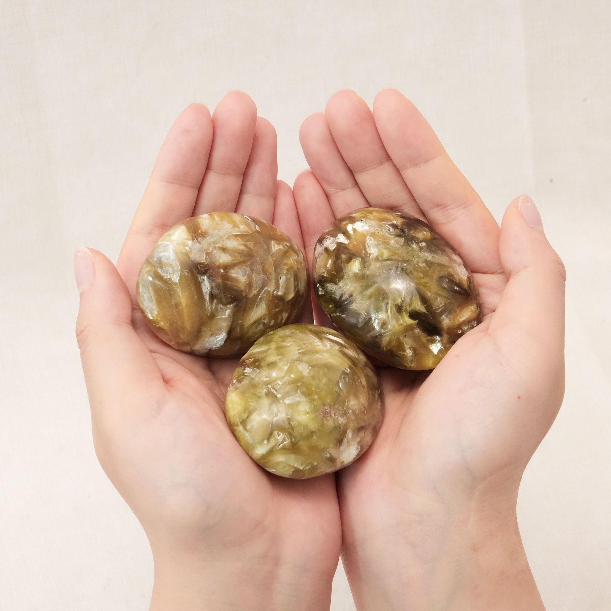 Known for its ability to relieve stress, the Golden Lepidolite Palm Stone is perfect for daily use