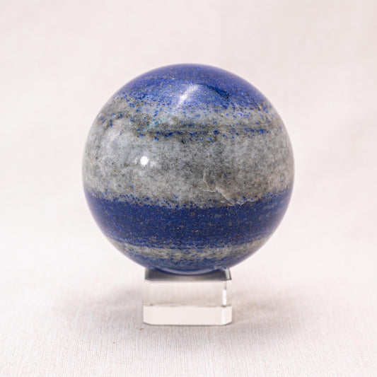  Deep blue lapis lazuli sphere with gold flecks, perfect for enhancing your home decor and promoting tranquility.
