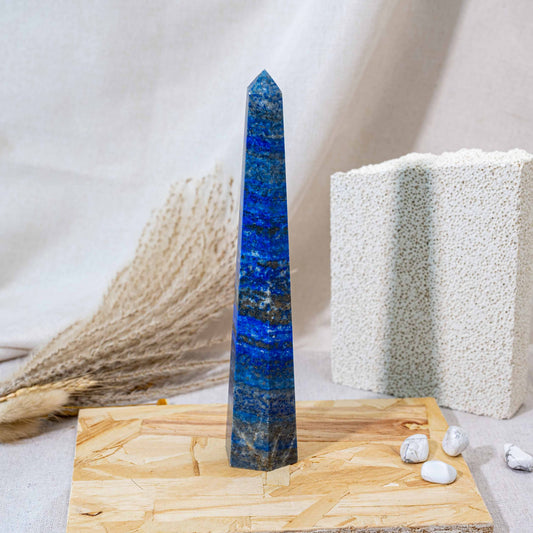 The Lapis Lazuli Tower is a powerful healing crystal known for its deep blue color and golden flecks, promoting wisdom and mental clarity