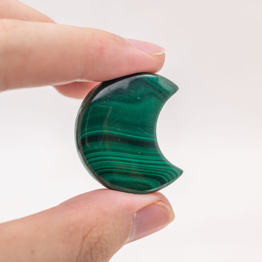 Hand-carved Malachite Moon for promoting spiritual growth and inner peace.