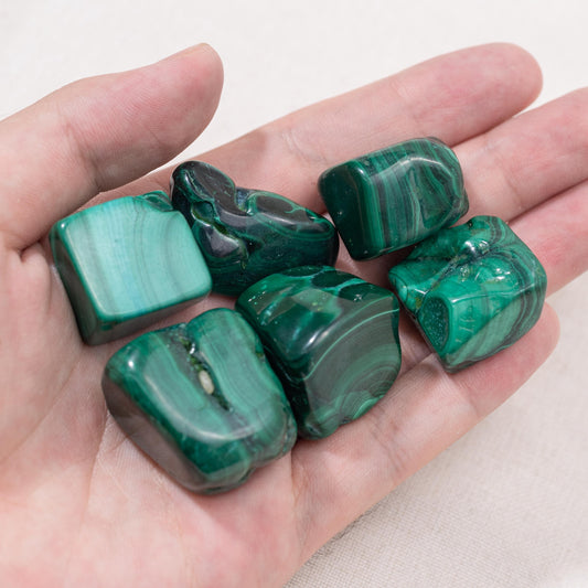 This intricately polished Malachite Tumbled Stone is perfect for those seeking emotional healing and balance.